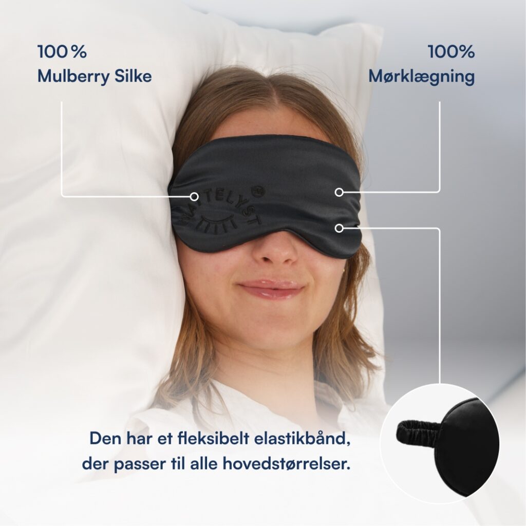 Kvinde med sort mulberry-silke øjenmaske med elastik, fuld mørklægning, liggende på pude